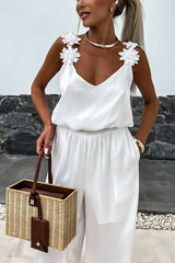 NOVERA™ | Mouwloze jumpsuit met wijde pijpen