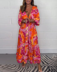 NOVERA™ | Diepe V kleurrijke lange jurk