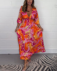 NOVERA™ | Diepe V kleurrijke lange jurk